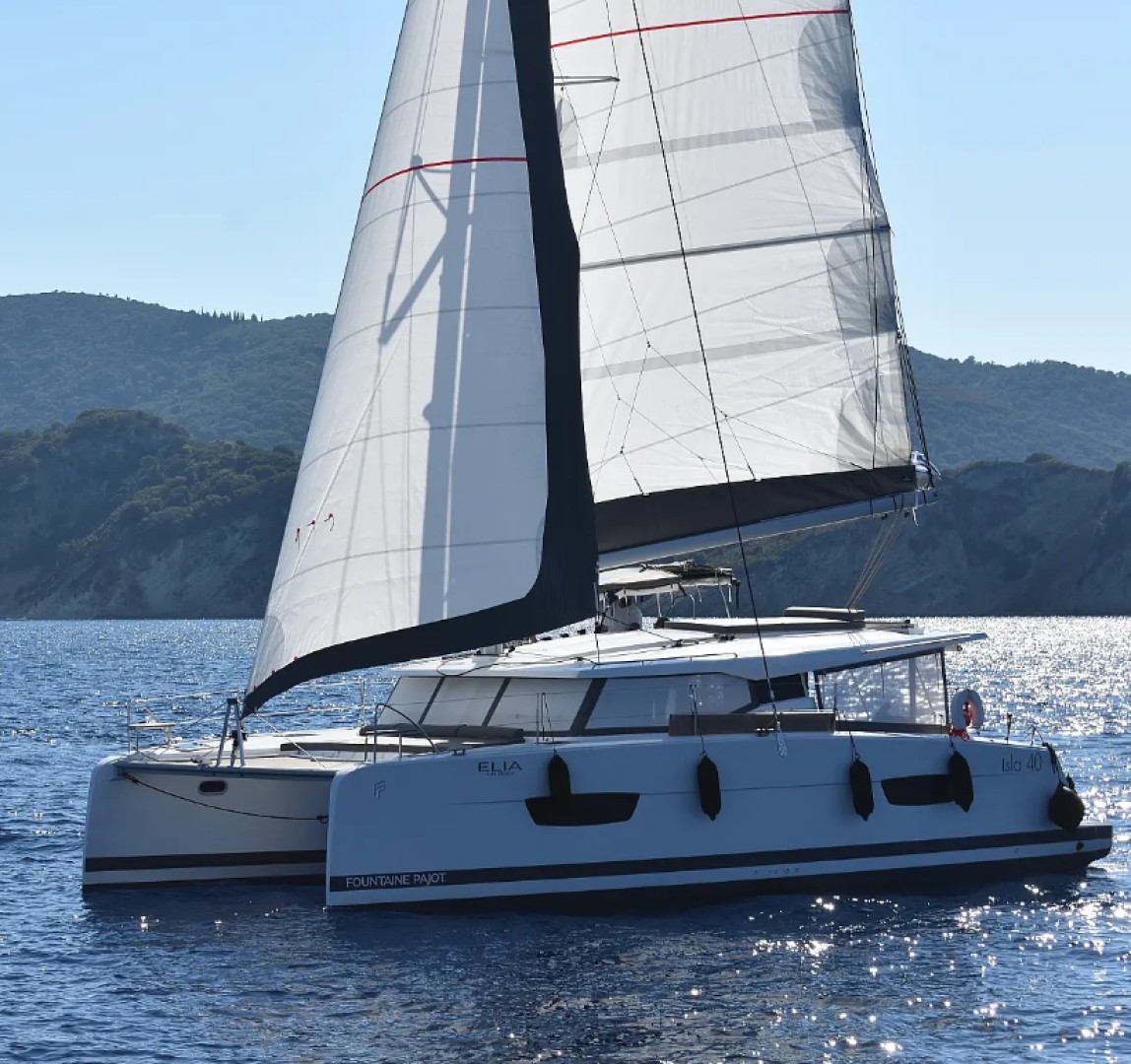 Eco solar yacht anchored in a Greek Ionian cove