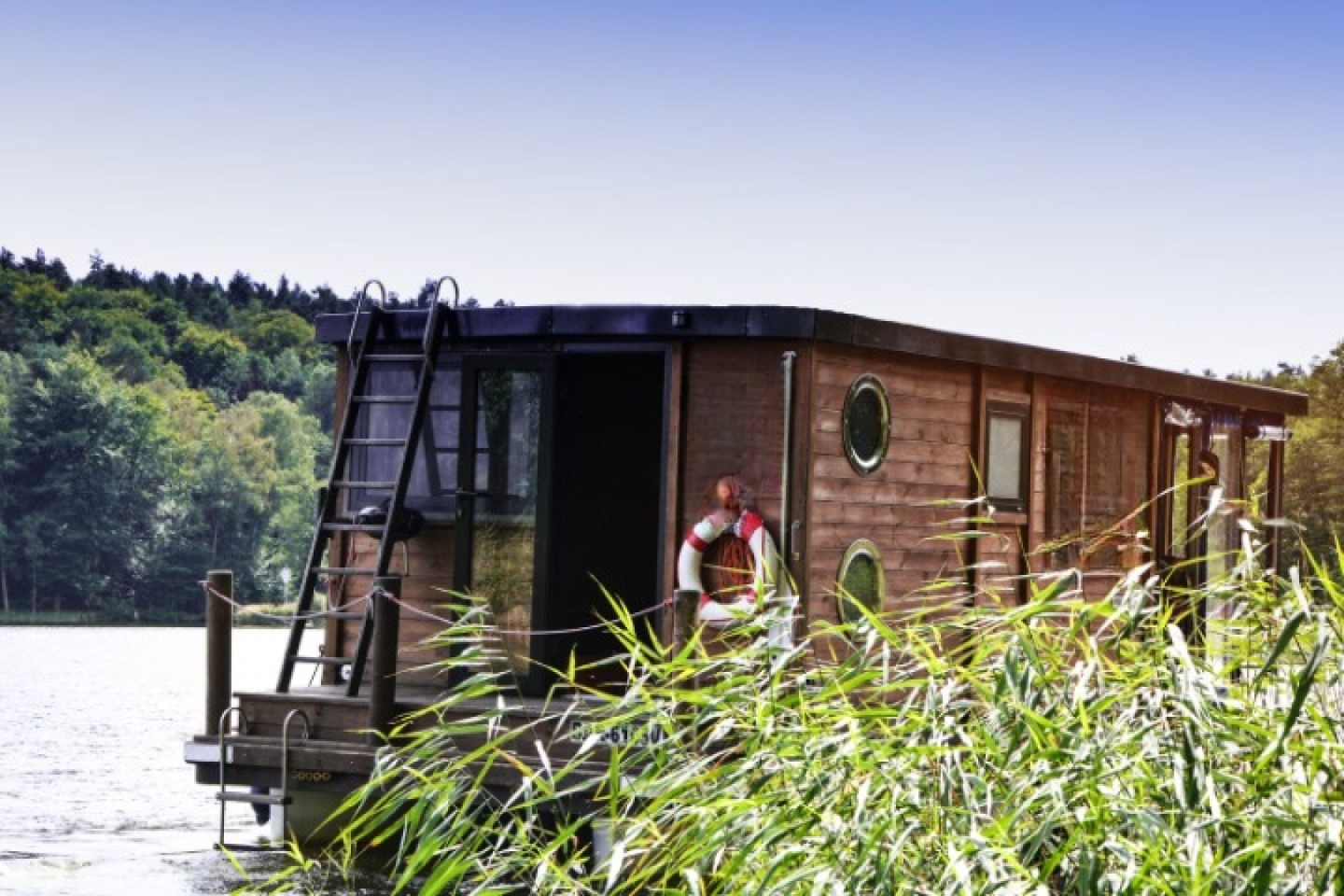 Floss D7 closable terrace eco solar houseboat charter on Wolziger See, Germany