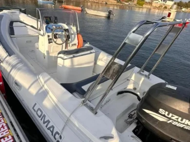 Lomac Lomac 660 IN charter bareboat or captained in  Larmor-Baden